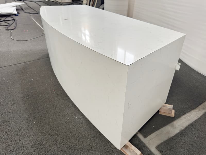 Curved counter with wooden cabniet