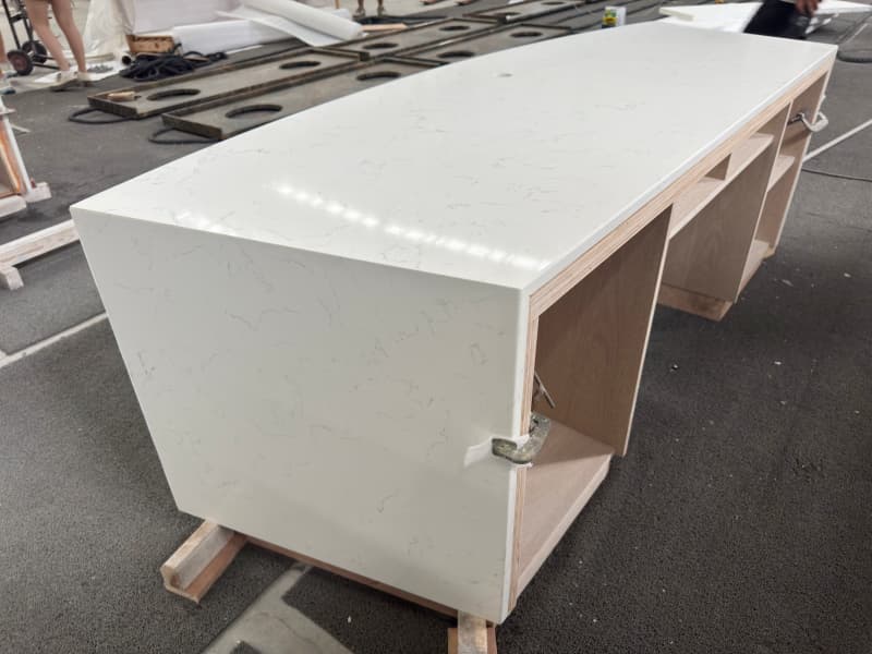 Curved counter with wooden cabniet