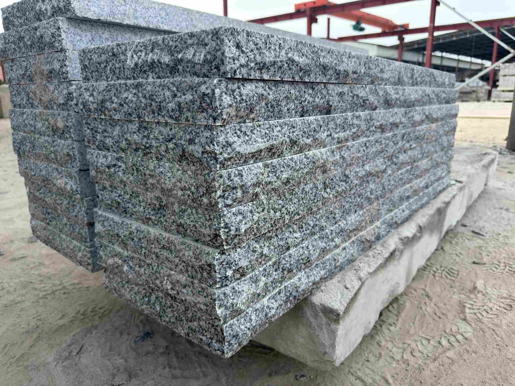 Thick Tema Grey solid granite steps with thermal tops and rock-faced fronts