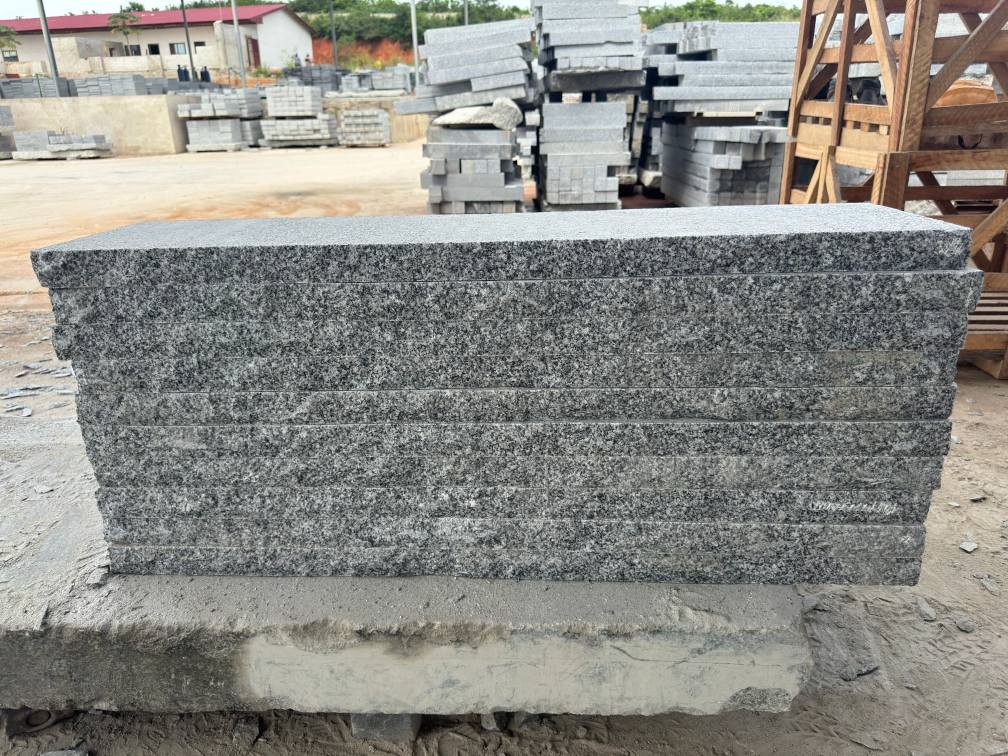 Tema Grey granite stair treads installed with matching grey granite pavers