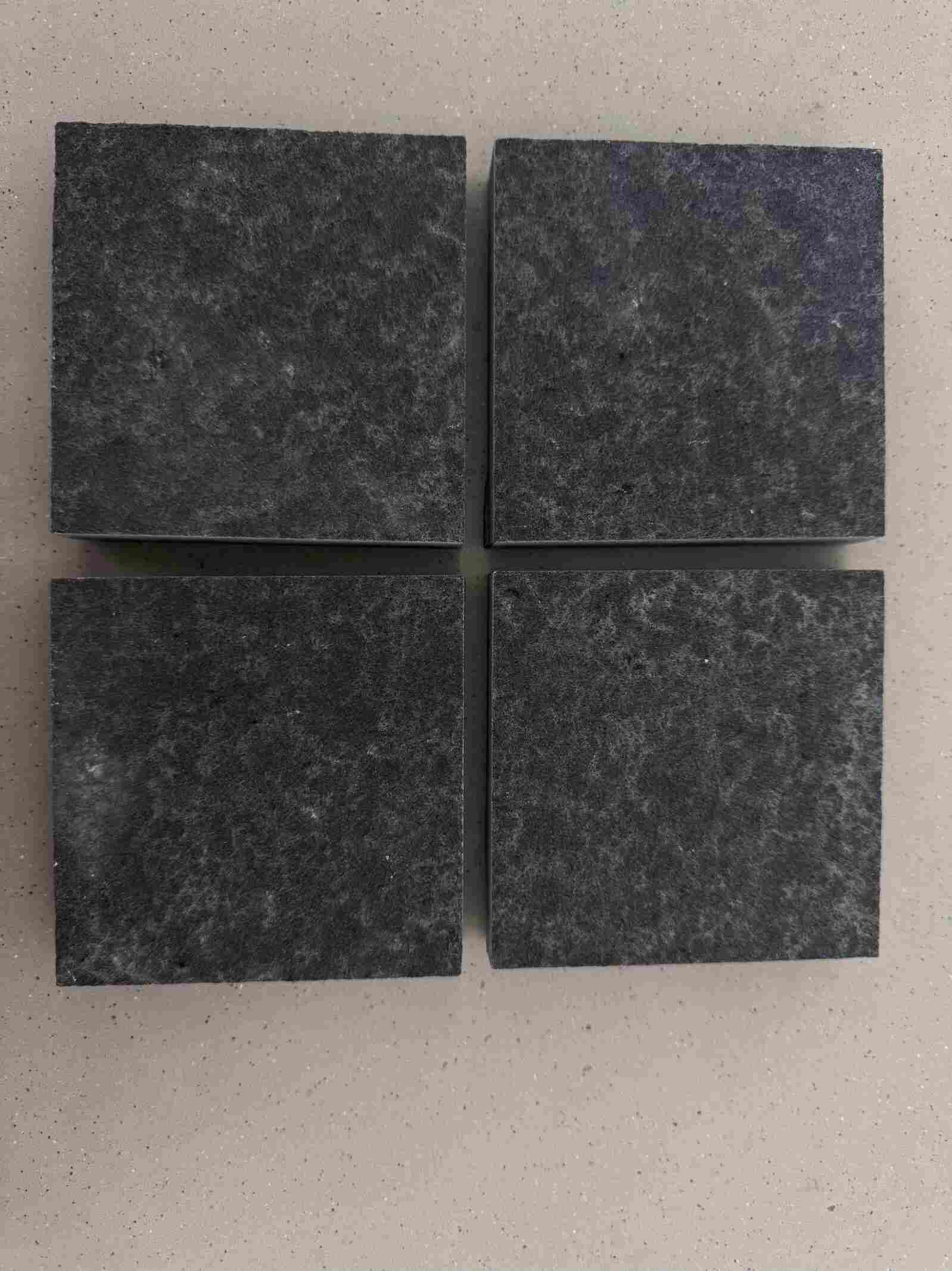 Dry water-washed Mongolian Black granite showing a matte textured surface.