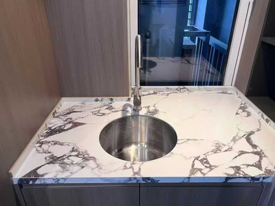 Custom Calacatta Viola marble basin fabricated from selected slabs