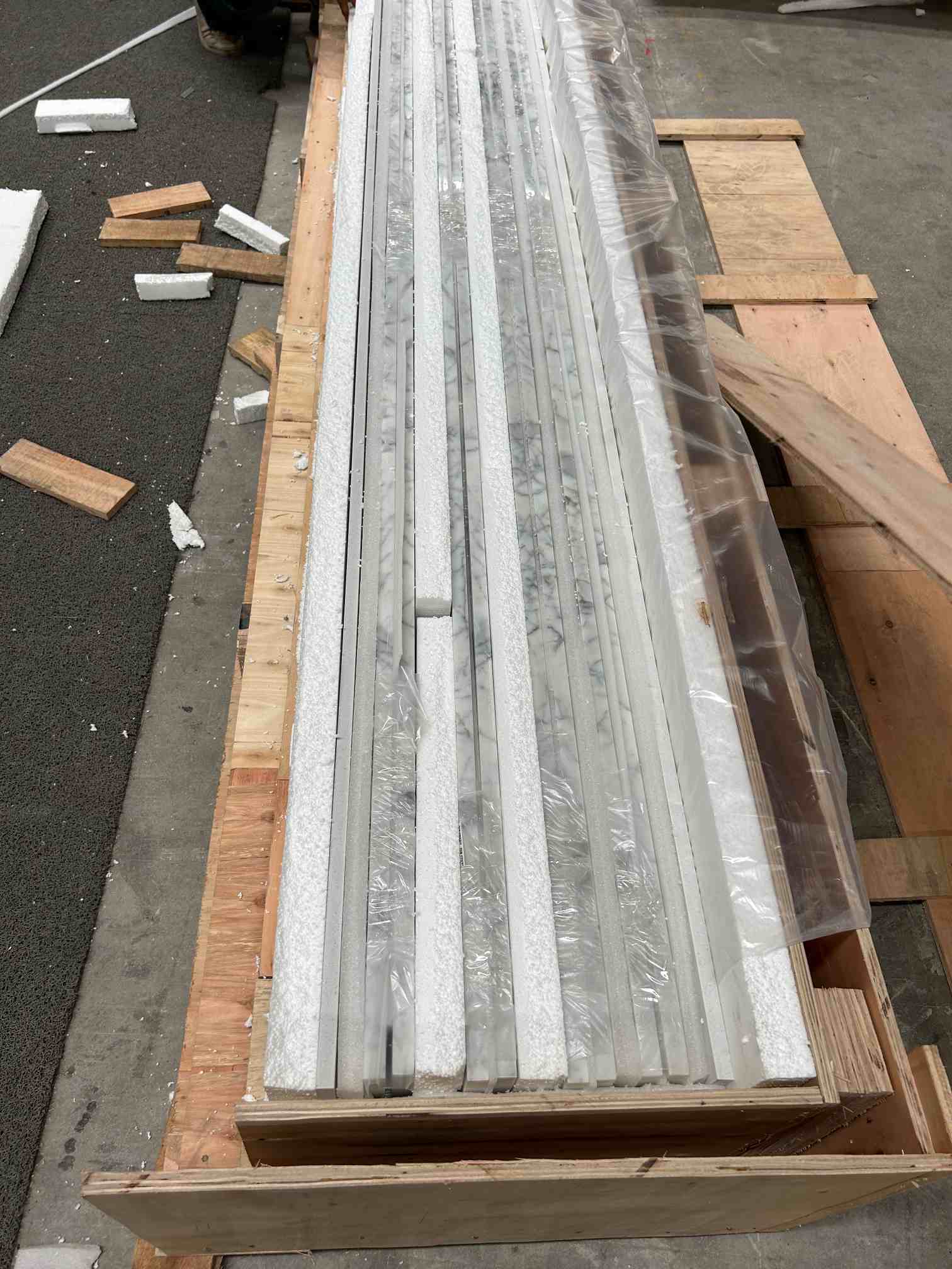 Calacatta White Marble Project Packing Calacatta White marble project pieces protected with foam inside a wooden crate