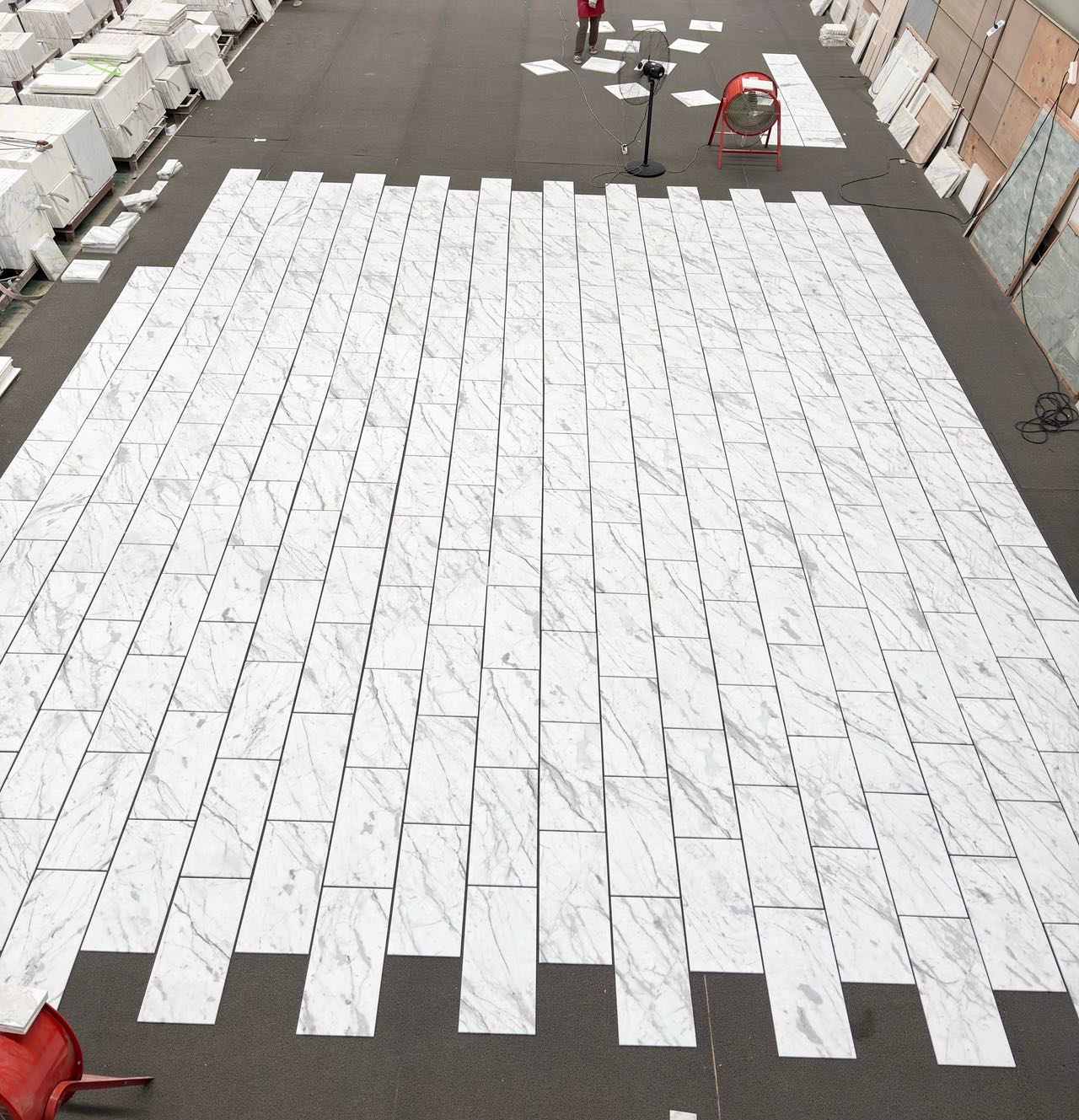 Continuous Vein Calacatta White Tile Layout Vein-matched Calacatta White marble tiles arranged for continuous movement