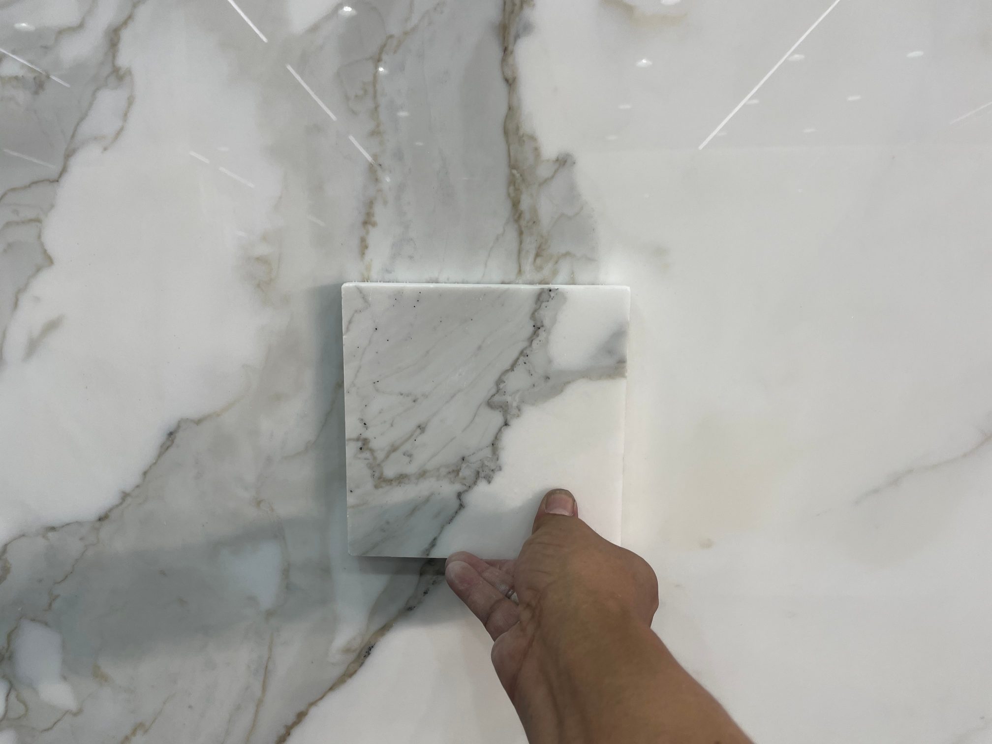 Calacatta White Pattern Matching Customer Calacatta White sample matched to slab with central grey veining