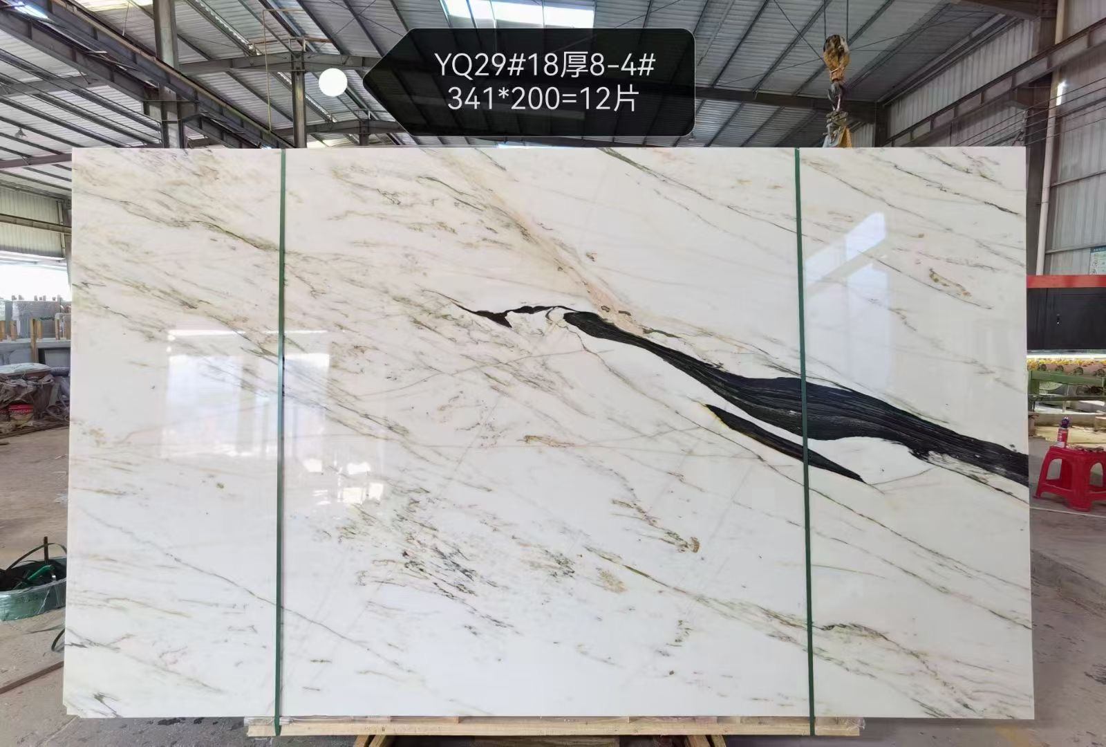 Oriental Calacatta White marble slab with bold black veins on a clean white background