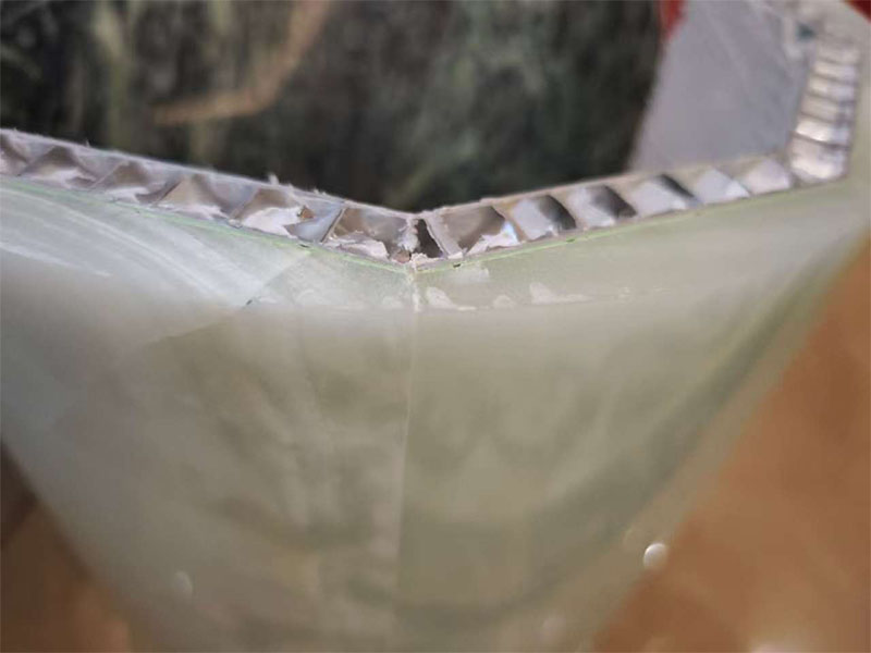 Backed curved marble panel showing the relationship between the stone facing and supporting construction.