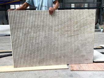 Fluted beige marble wall panels